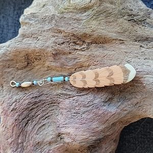 Feather pendant.